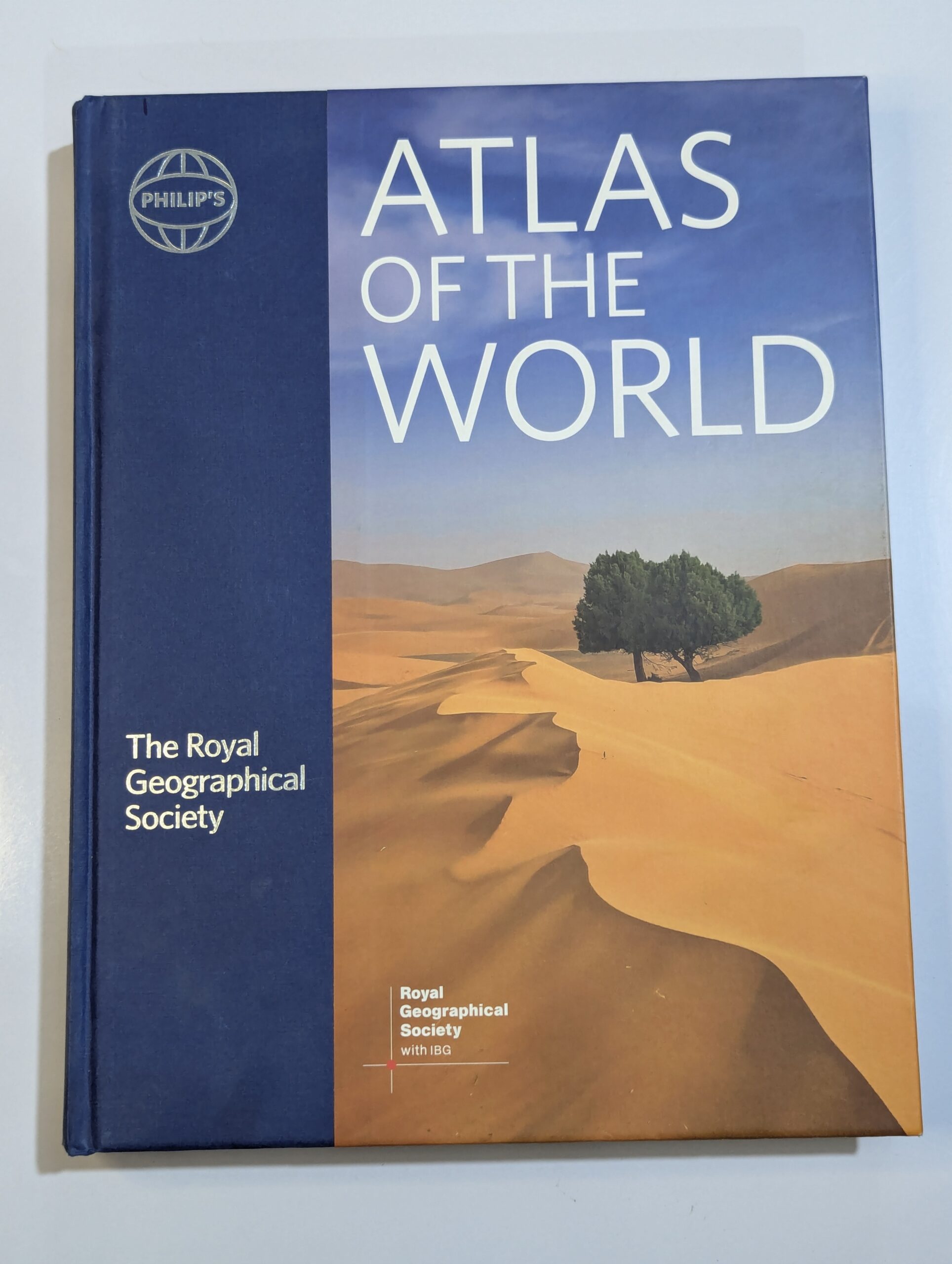 Royal Geographical Society atlas cover — Atlas of the World — comprehensive world reference with political and physical maps