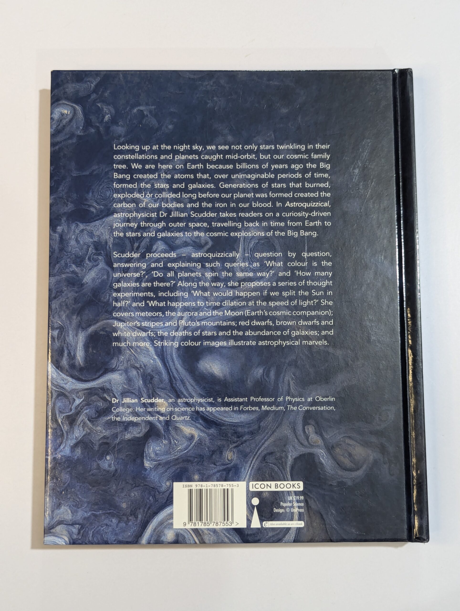 Inside spread from Astroquizzical showing stunning space illustrations, diagrams of galaxies, and answers to cosmic puzzles