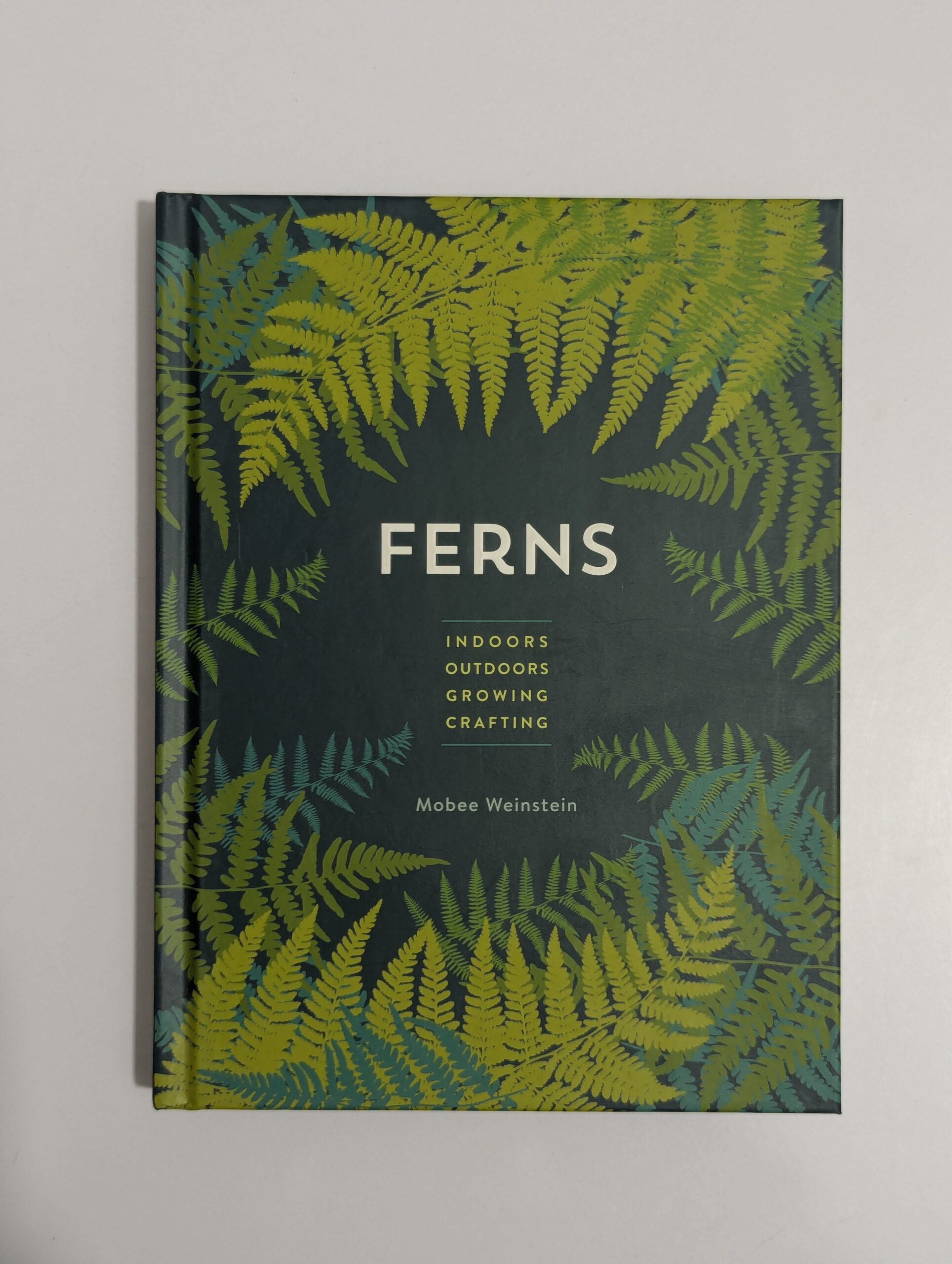 Ferns book cover by Mobee Weinstein showing a lush green fern against a soft background — indoor and outdoor growing and crafting guide