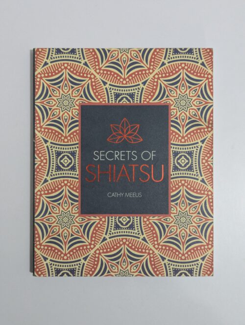 Secrets of Shiatsu book cover by Cathy Meeus featuring a hand applying pressure to a person's shoulder with a serene background